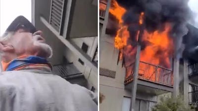 Hardloper helpt vrouw uit brandende hotelkamer springen